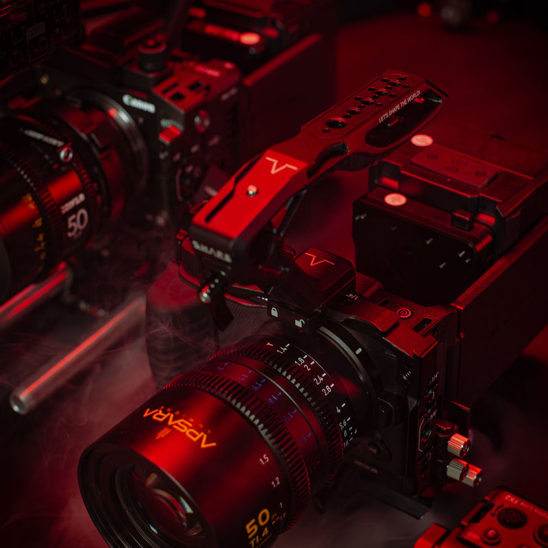 SHAPE Nikon ZR camera cage close-up showing 1/4-20 and 3/8-16 threaded mounting points in red cinematic lighting with a overview